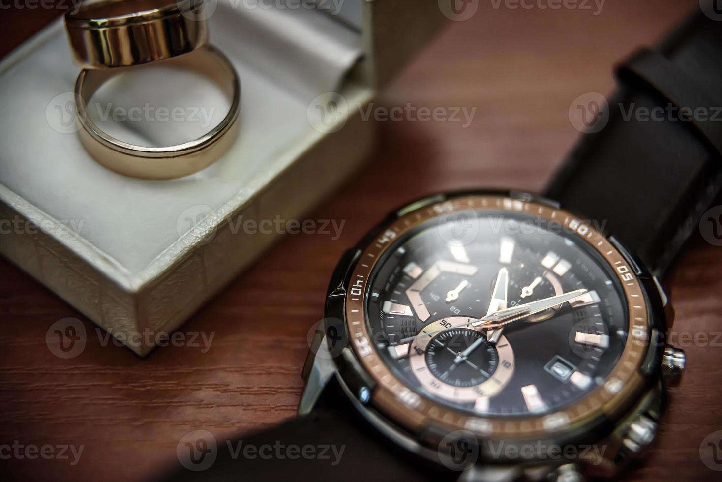 wedding ring in a box and watch the groom photo