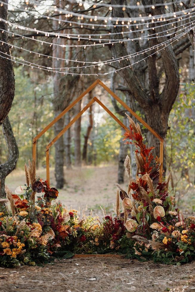 wedding ceremony area with dried flowers in a meadow photo