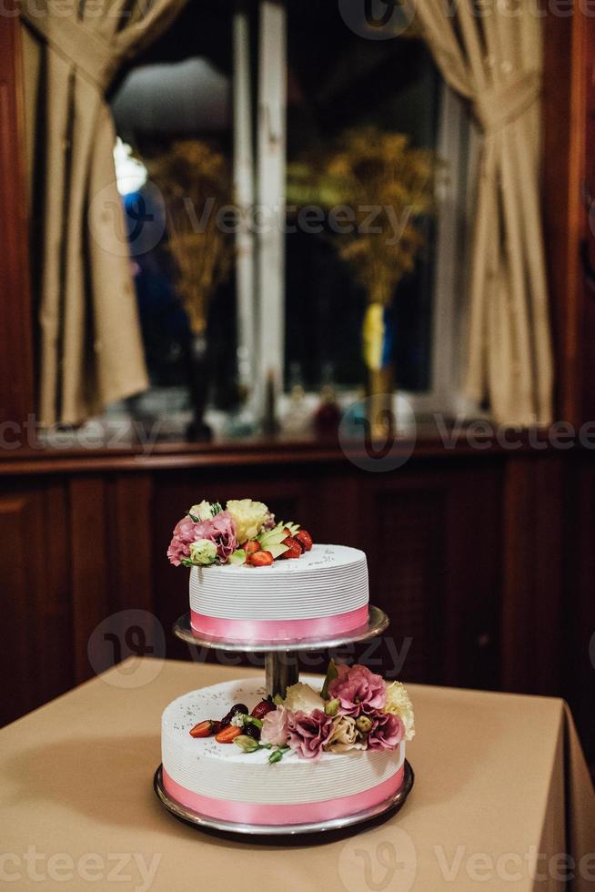 wedding cake at the wedding of the newlyweds photo