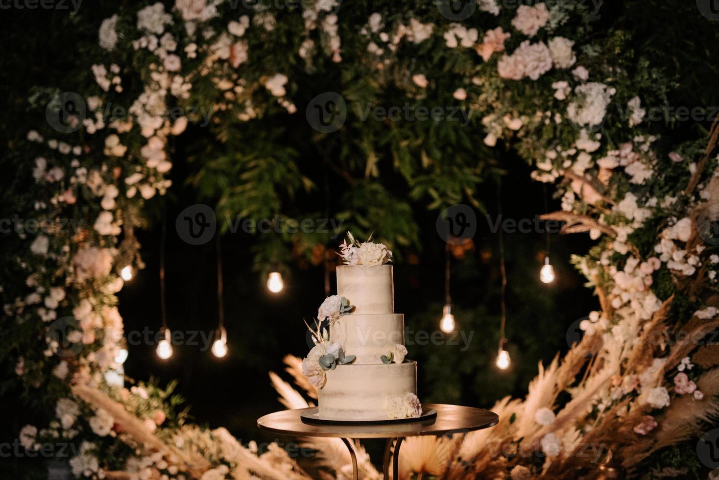 wedding cake at the wedding of the newlyweds photo