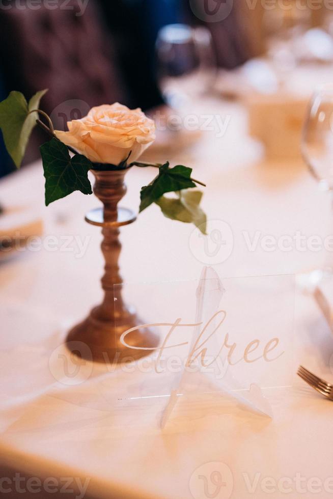 elegant wedding decorations made of natural flowers and green elements photo