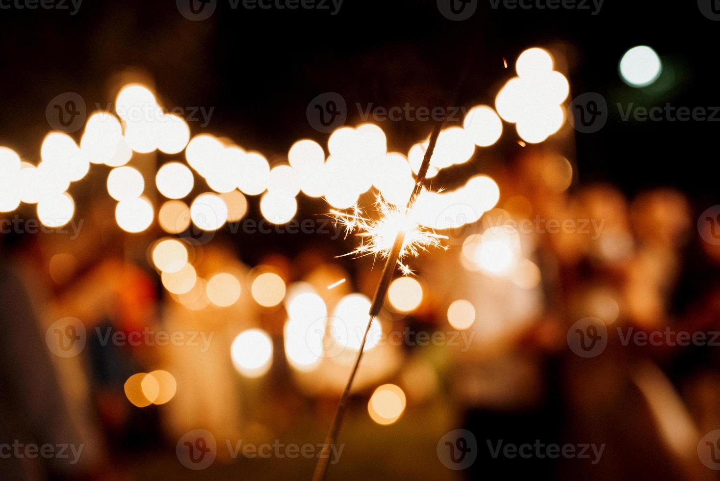 sparklers at the wedding, light on the background... photo