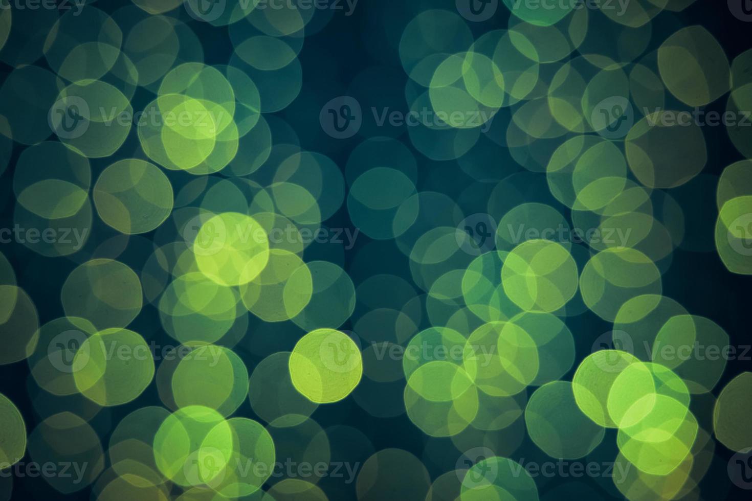 Green background with natural bokeh defocused sparkling lights. photo