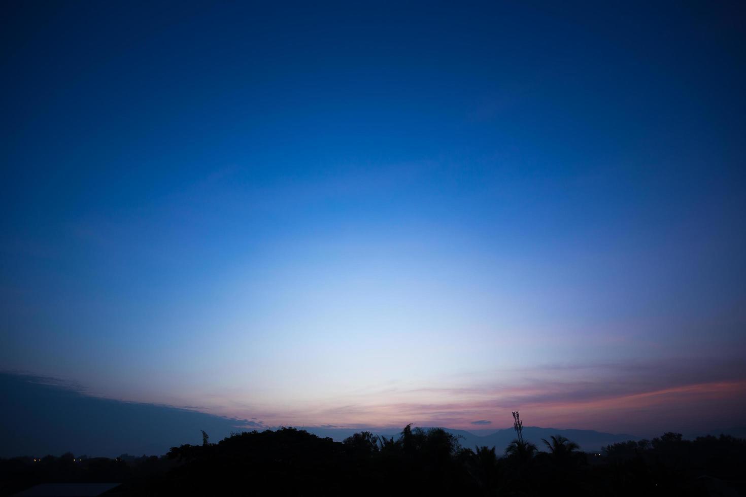 Colorful dramatic sky with cloud at sunset. photo