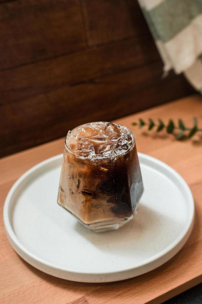 Glass of coffee with milk on the table photo