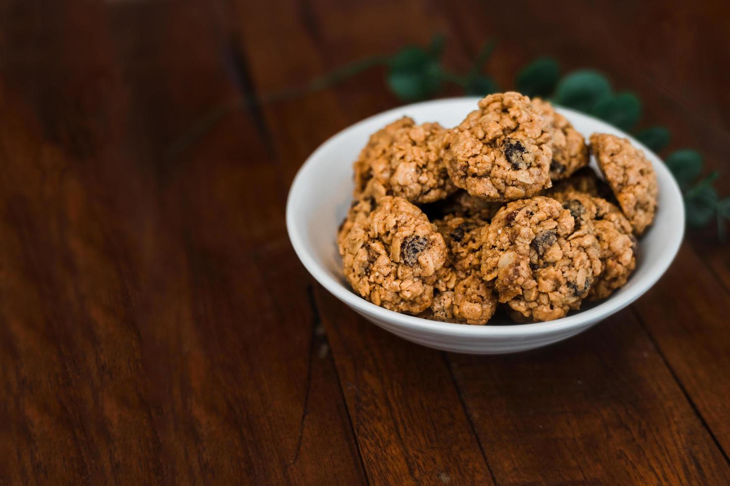 Soft oatmeal cookies on a wooden table photo