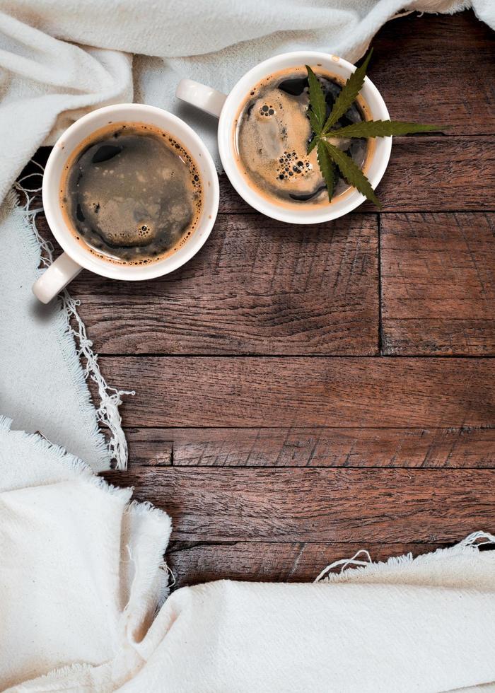 Cannabis coffee with coffee beans on table on the table photo