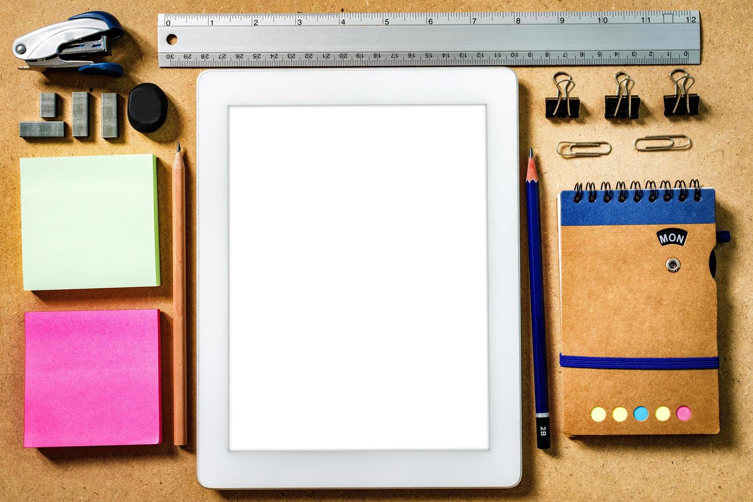 Mockup tablet. Top view of wooden desk. photo