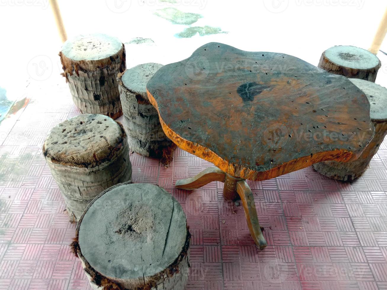 table and stool from tree on park photo