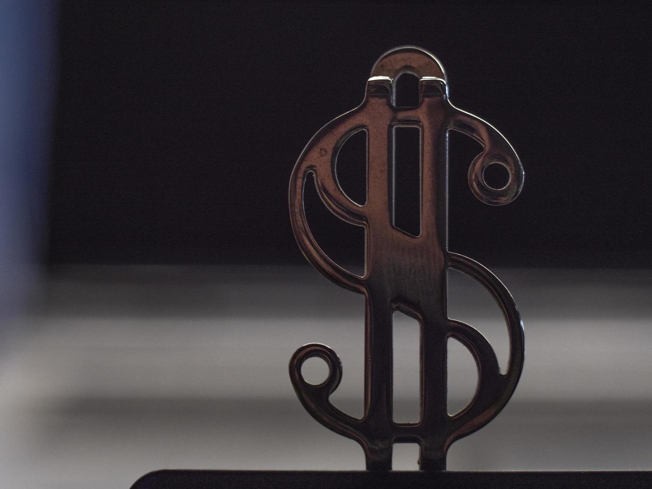 close up of metallic golden dollar sign photo