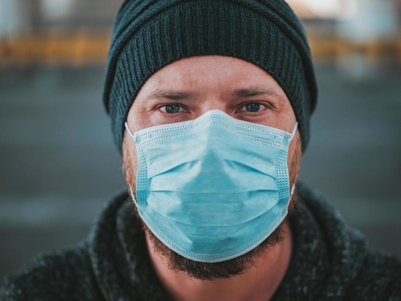 Close Up Portrait Of A Hipster Man In A Medical Mask photo