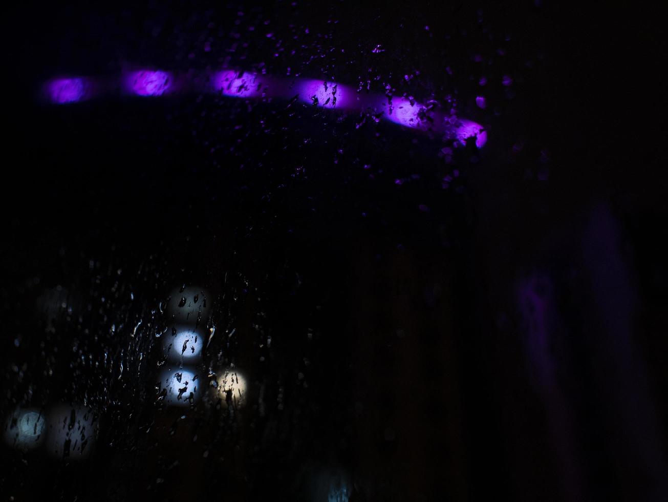 Rain Drop at the night time with the blurred background photo