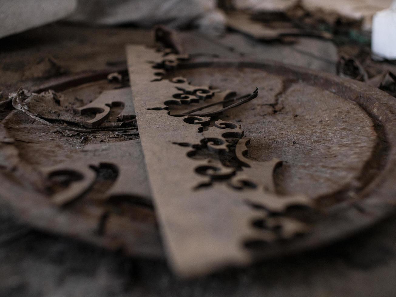 abstract wooden pattern on rusty iron cover on the ground photo