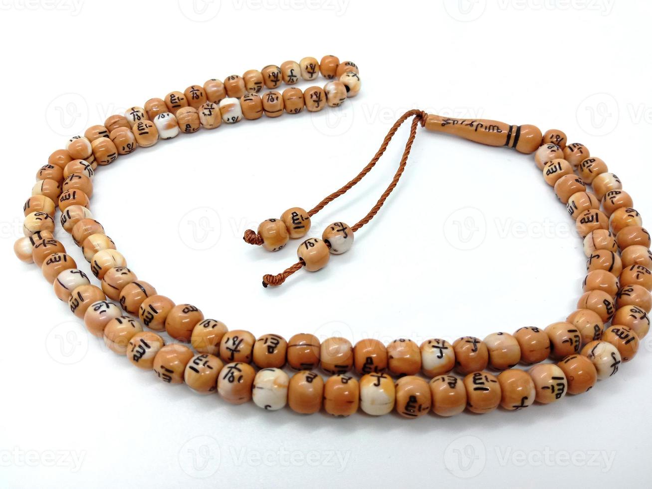 wooden beads closeup with allah word for pray photo