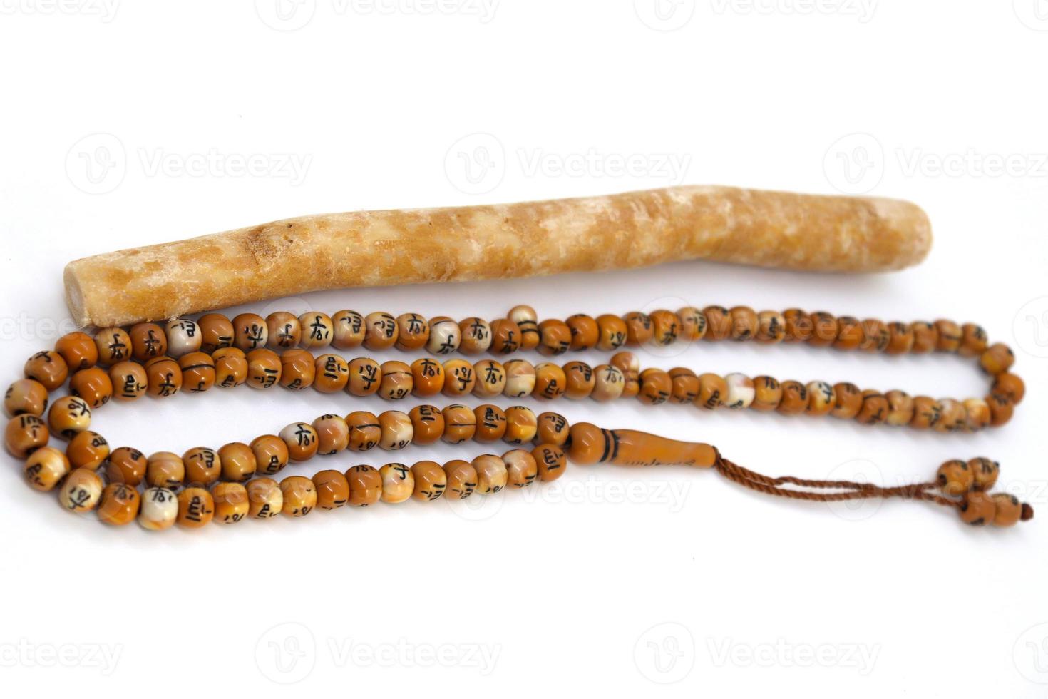 wooden beads and brush with allah word for pray photo