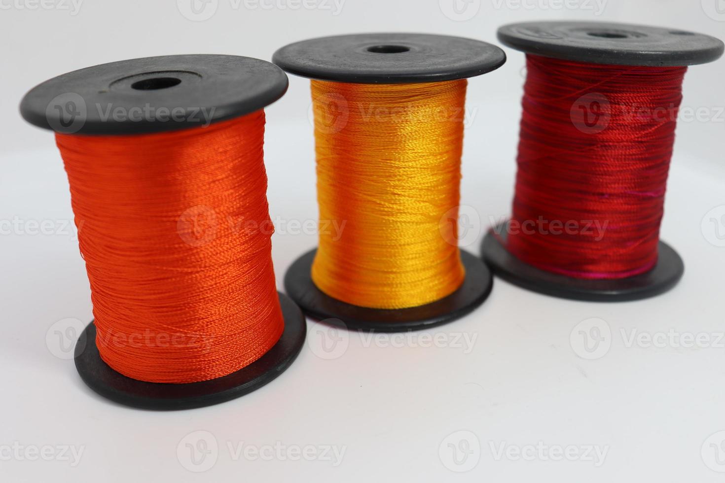 multiple colored yarn reel closeup for craft photo