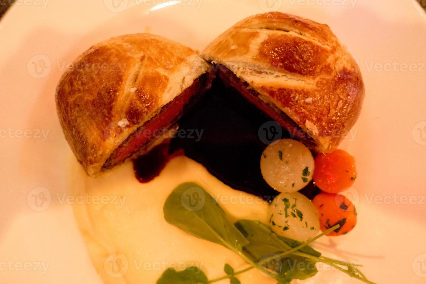 beef wellington tenderloin cooked for dinner photo