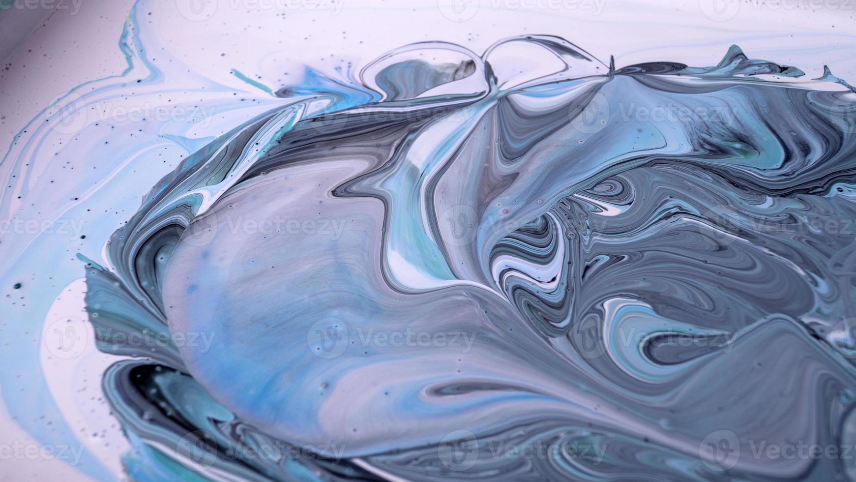 The colors of the aqueous ink are translucent. Abstract multicolored marble texture background photo