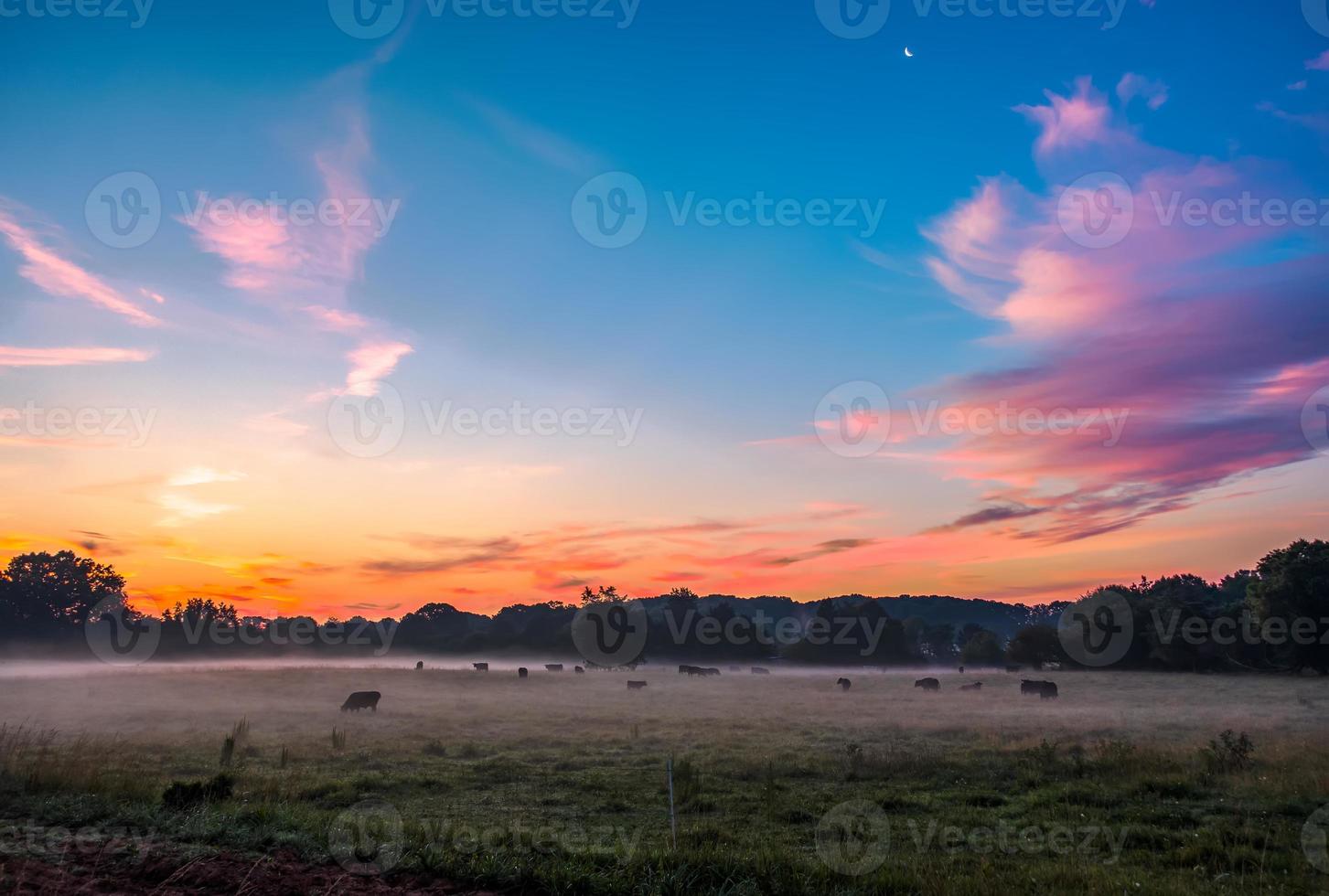 beautiful dreamy sunrise on the farm land in the country photo