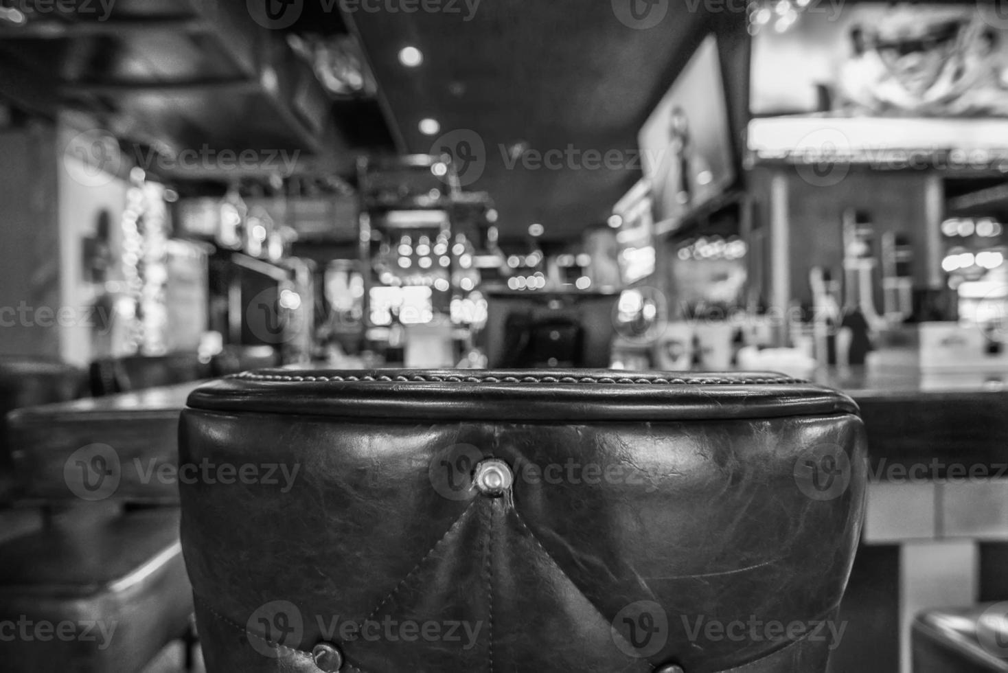 chairs and table with Blurred bar restaurant background photo