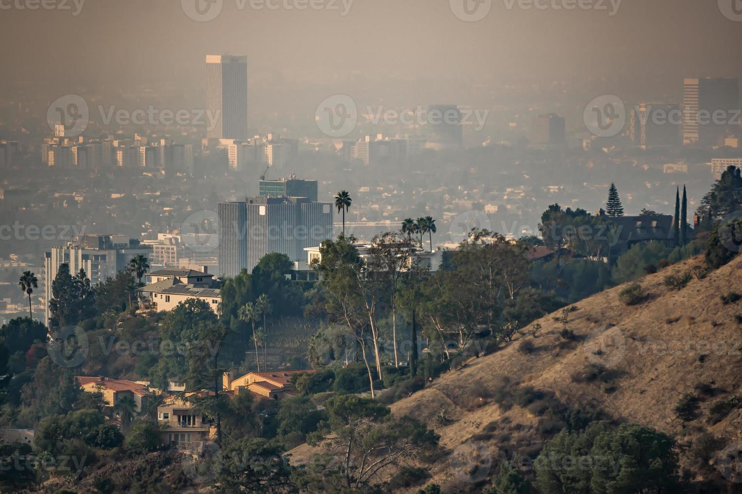 los angeles skyline and suburbs wrapped in smoke from woosle fires in 2018 photo