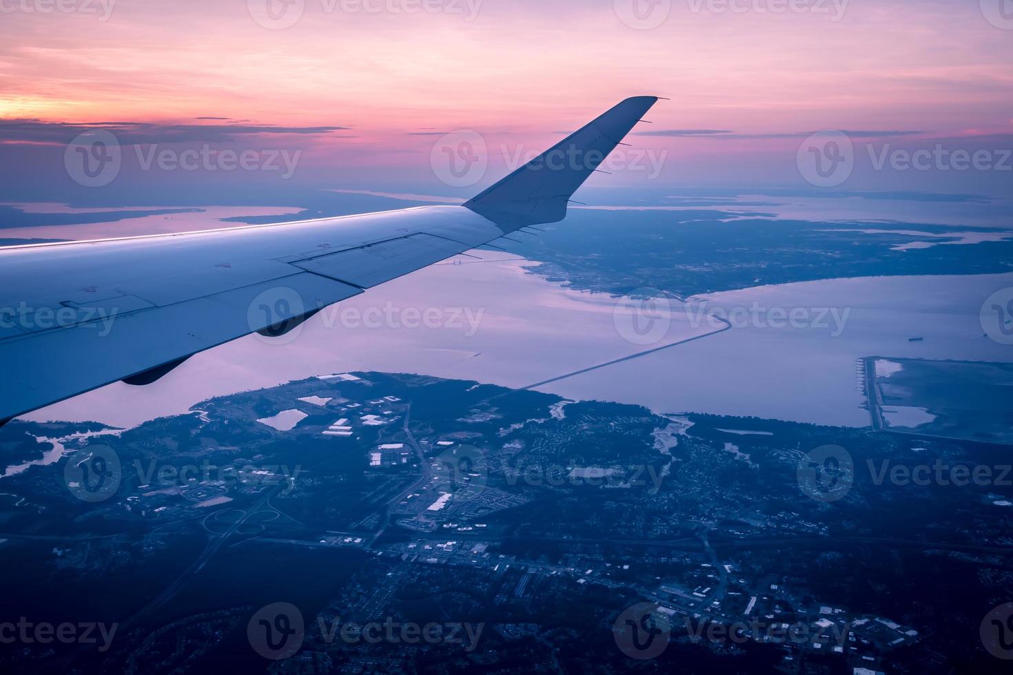 Sunset view from airplane window photo