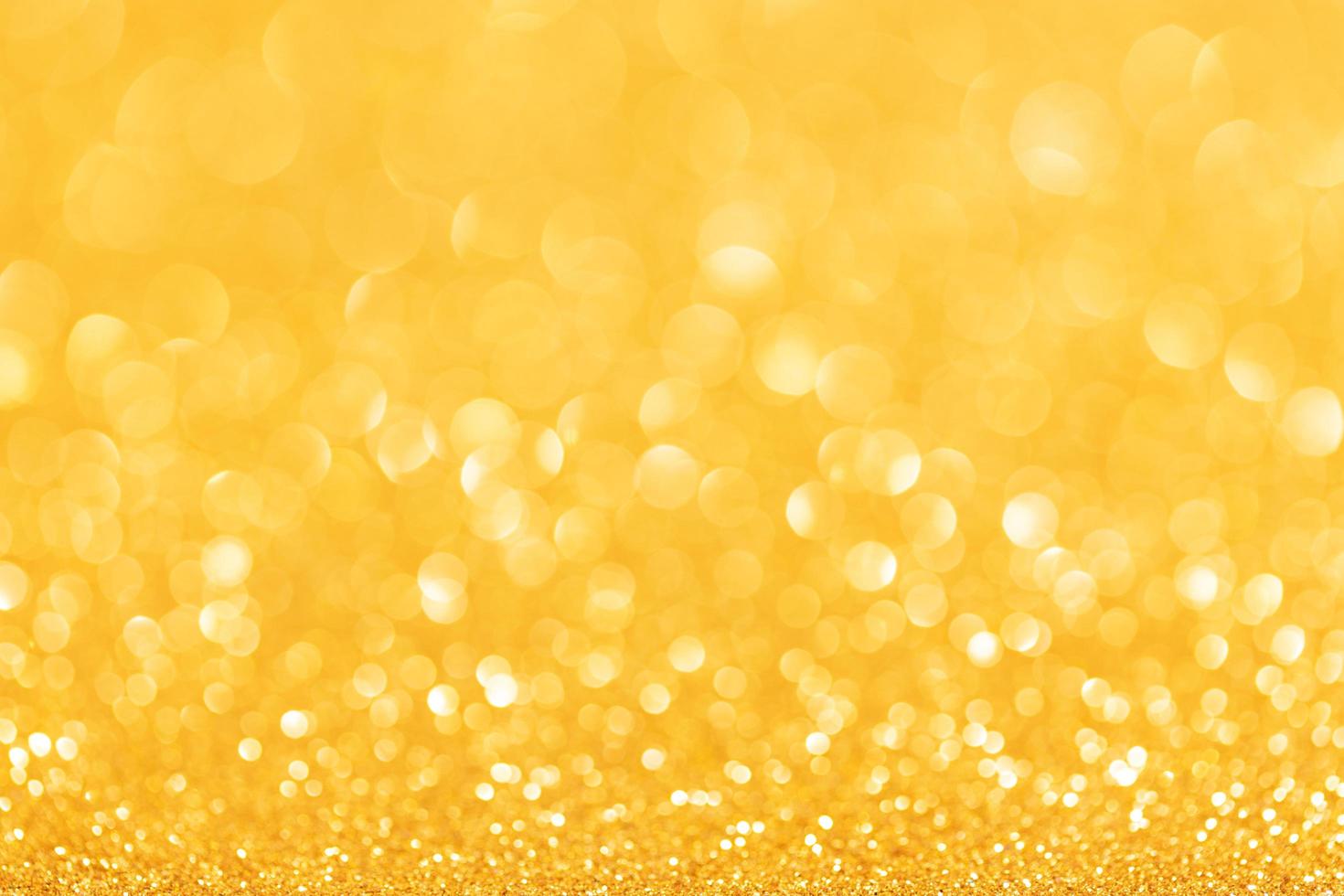 Festive Golden Glitter Abstract Background. Defocused sparkling backdrop photo