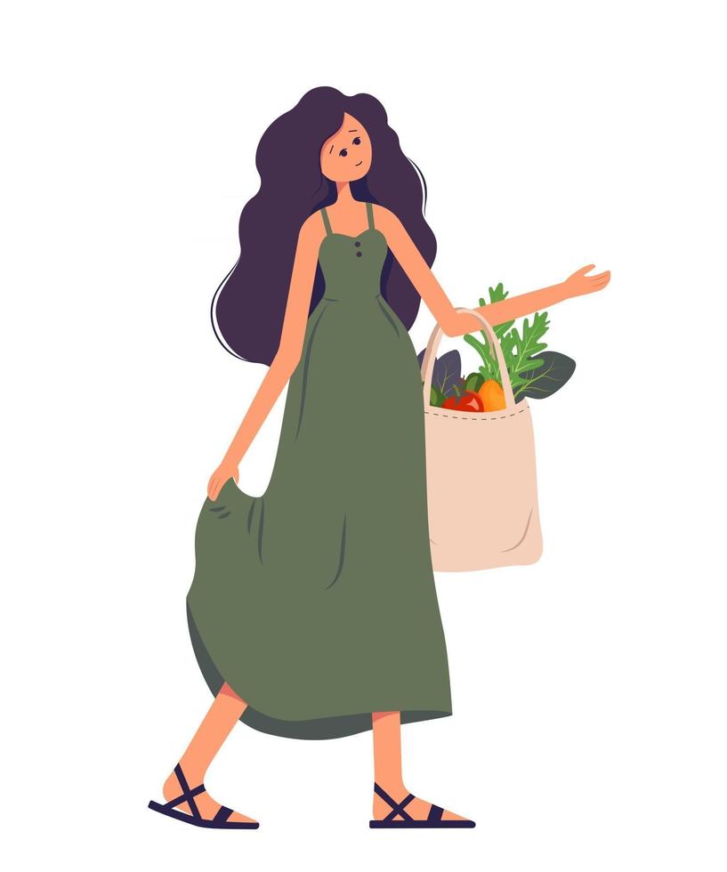 A woman holds a textile bag with vegetables in her hands vector