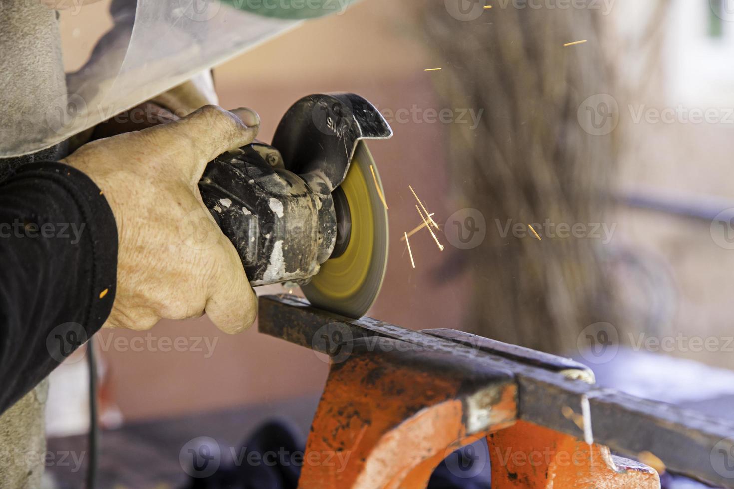 Cutting metal with an electric saw photo