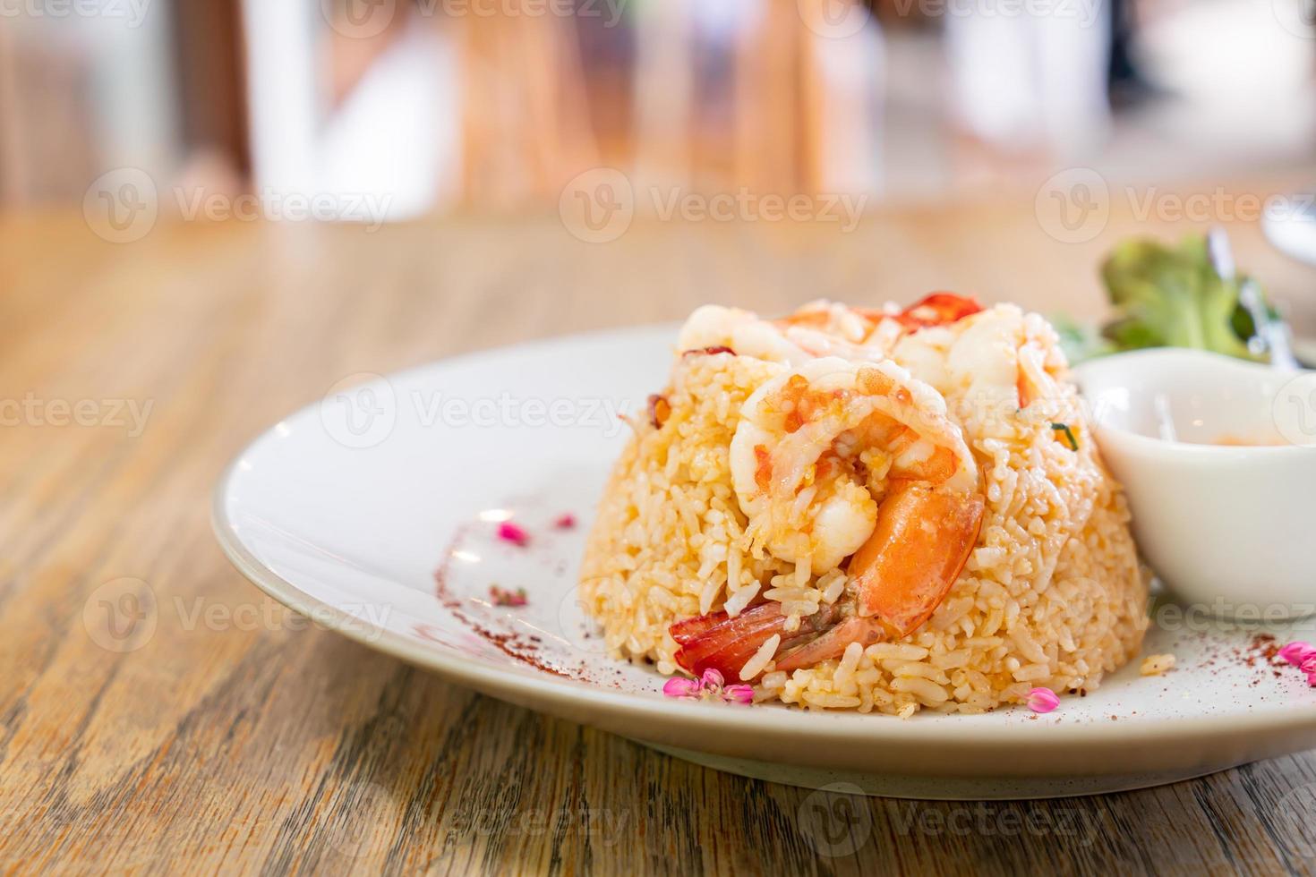 Shrimp fried rice with salt egg on plate photo