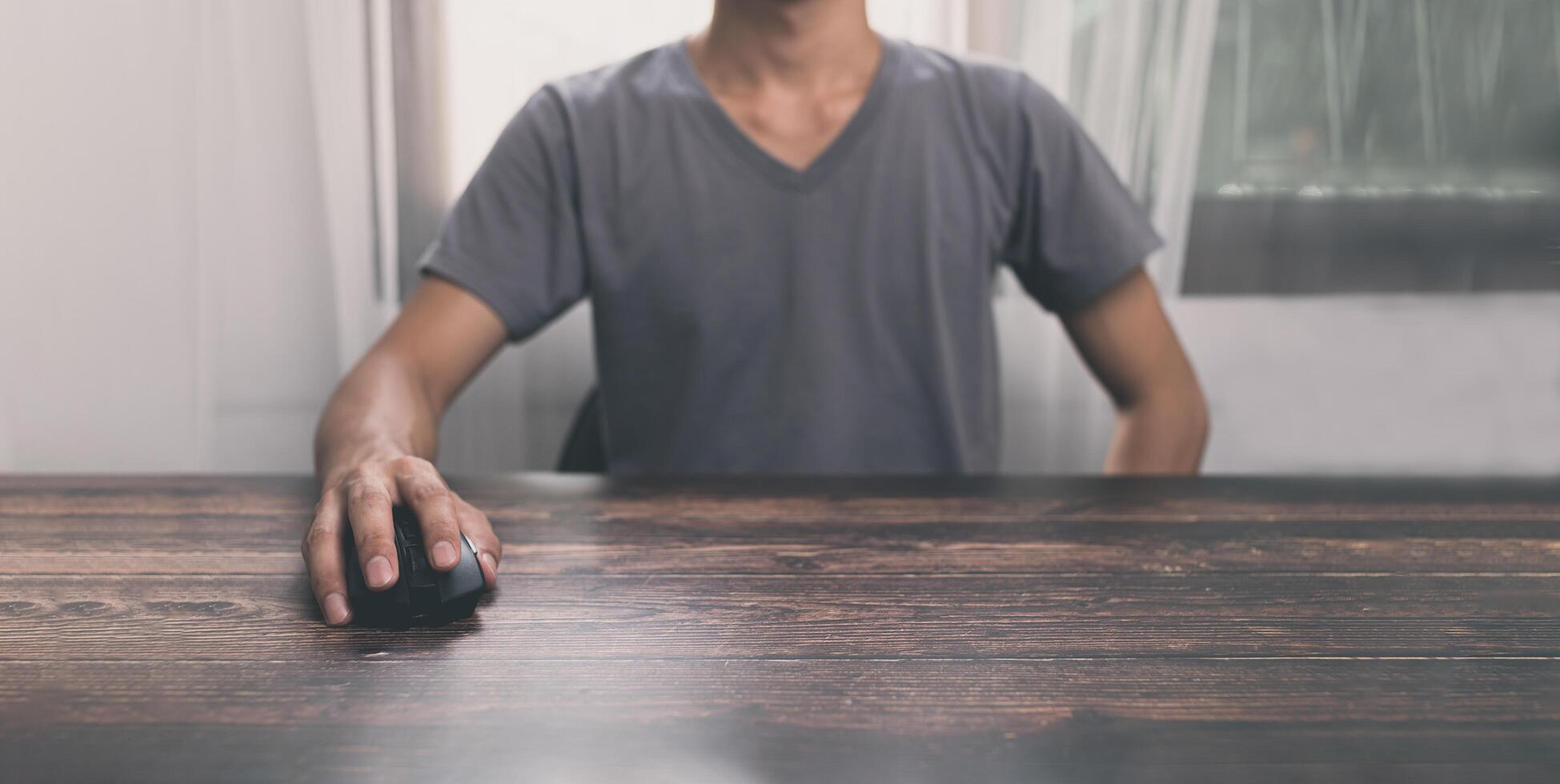 Man using computer mouse photo