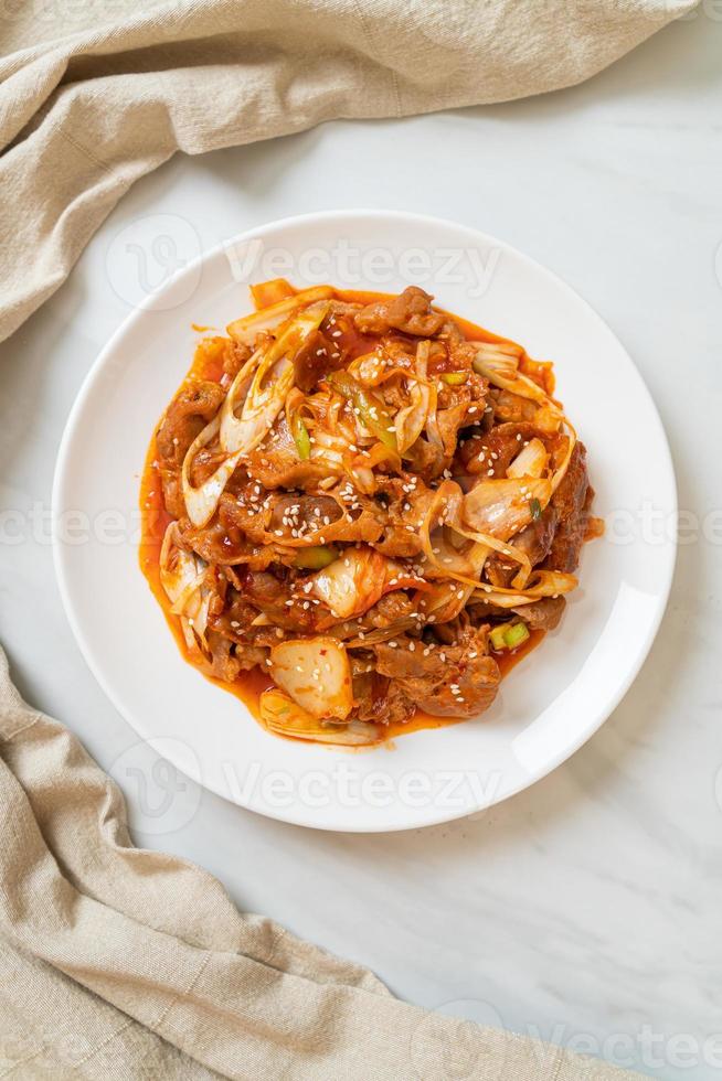 Stir-fried pork with Korean spicy paste and kimchi - Korean food style photo