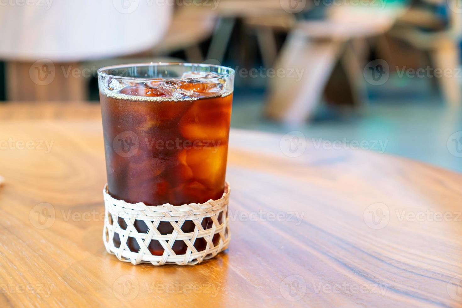 Iced Americano coffee glass in coffee shop cafe restaurant photo