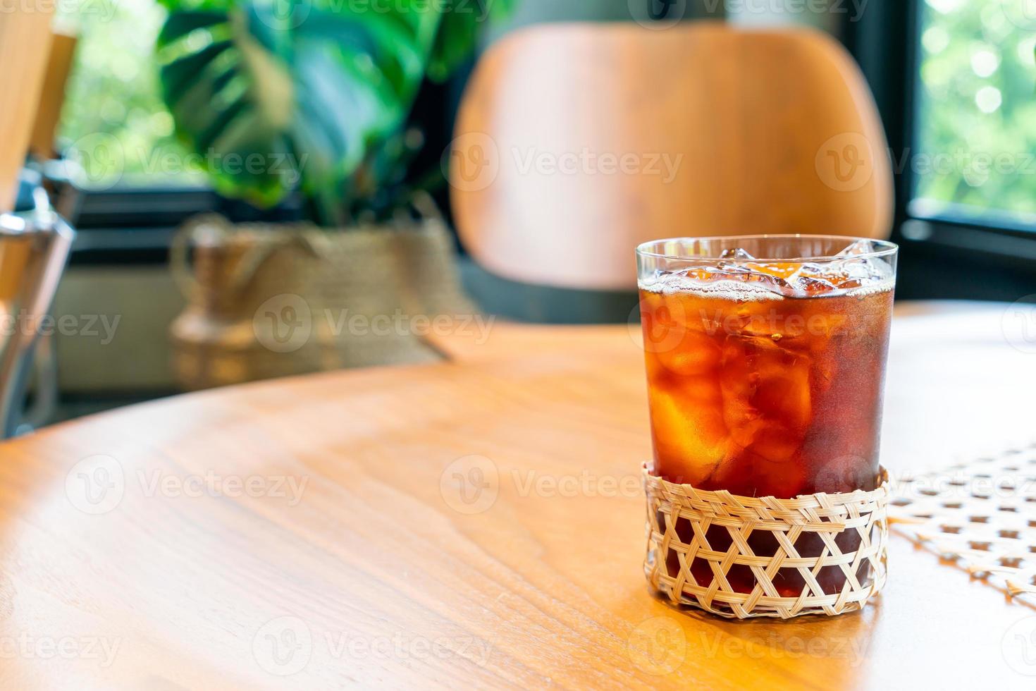 Iced Americano coffee glass in coffee shop cafe restaurant photo