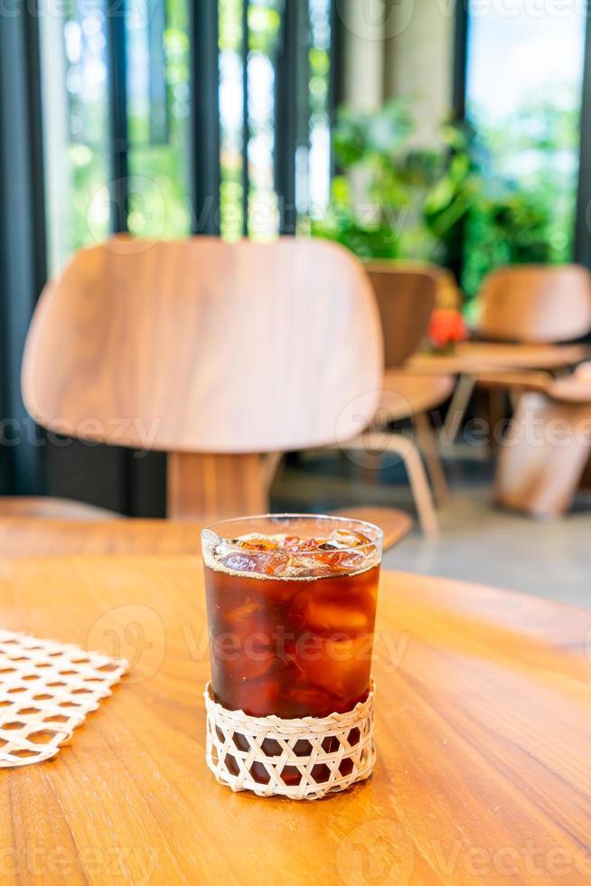 Iced Americano coffee glass in coffee shop cafe restaurant photo