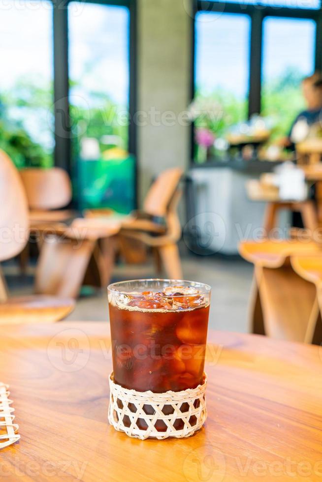 Iced Americano coffee glass in coffee shop cafe restaurant photo