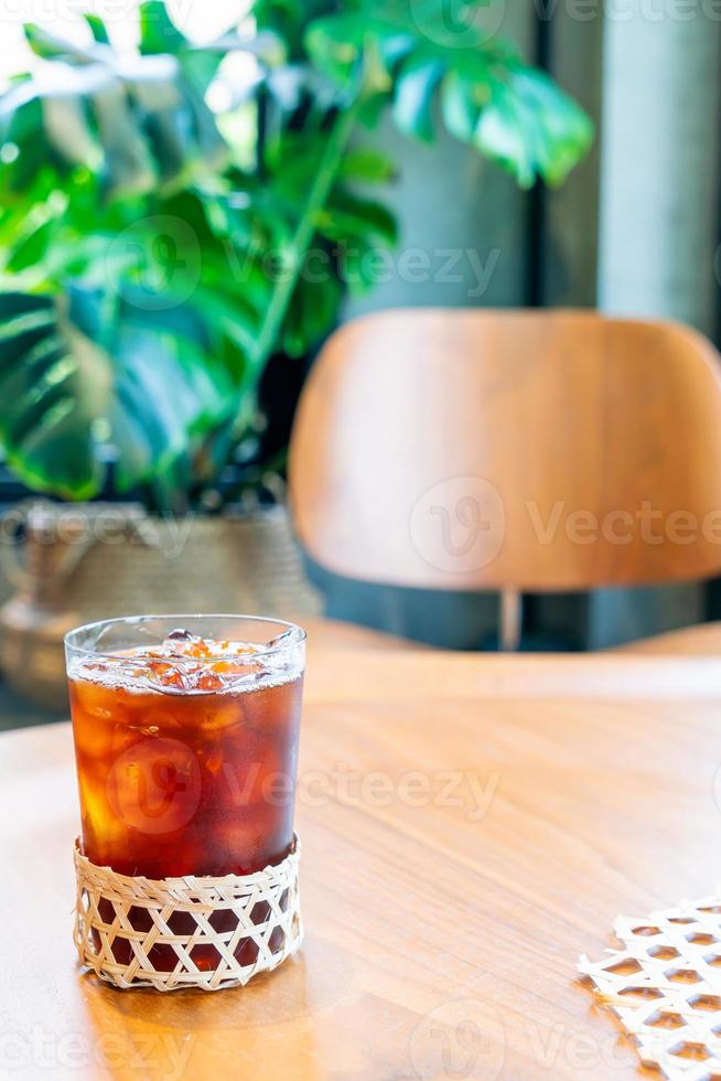 Iced Americano coffee glass in coffee shop cafe restaurant photo