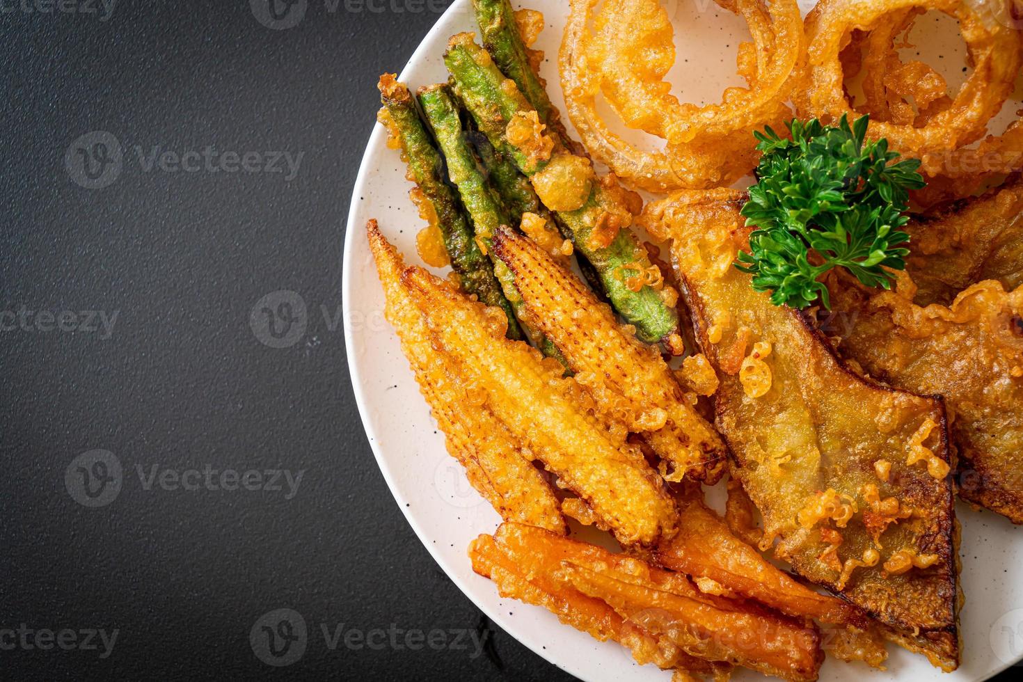 Fried mixed vegetable of onions, carrot, baby corn, pumpkin, or tempura - vegetarian food style photo