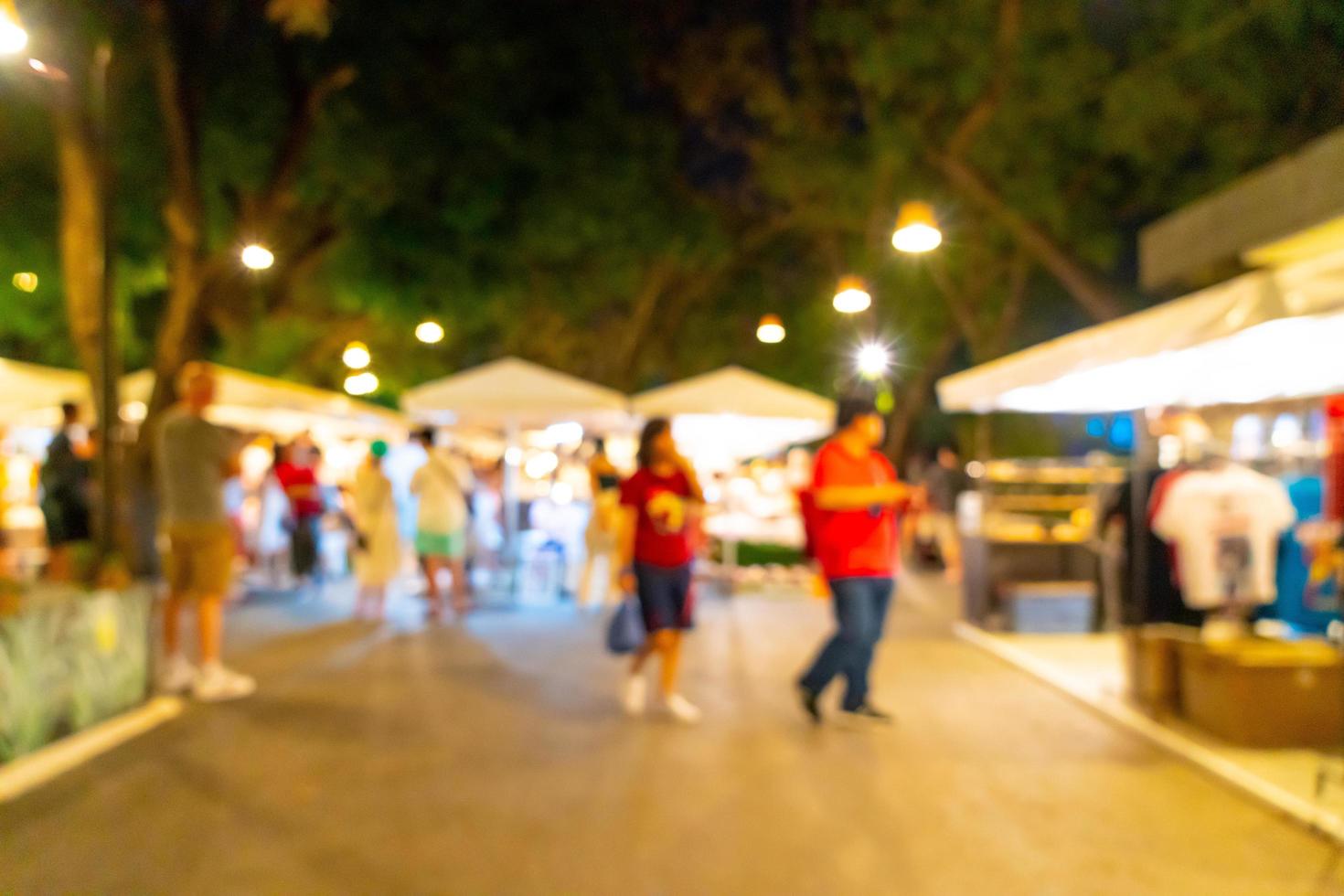 Abstract blur and defocused night street market for background photo