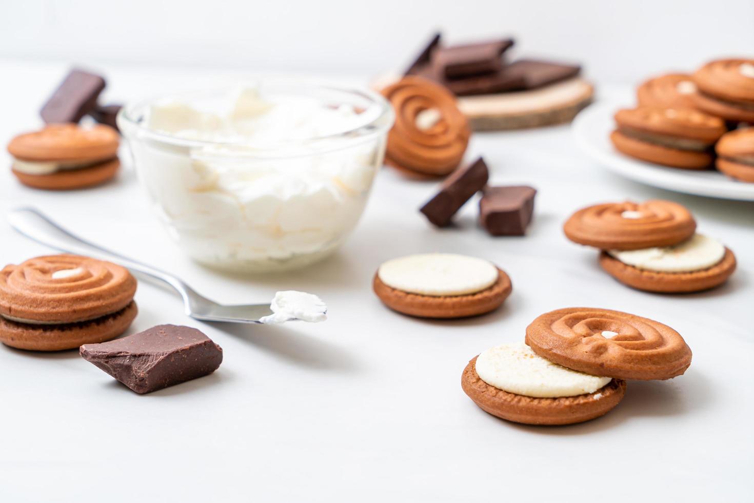 Chocolate cookies with milk cream photo