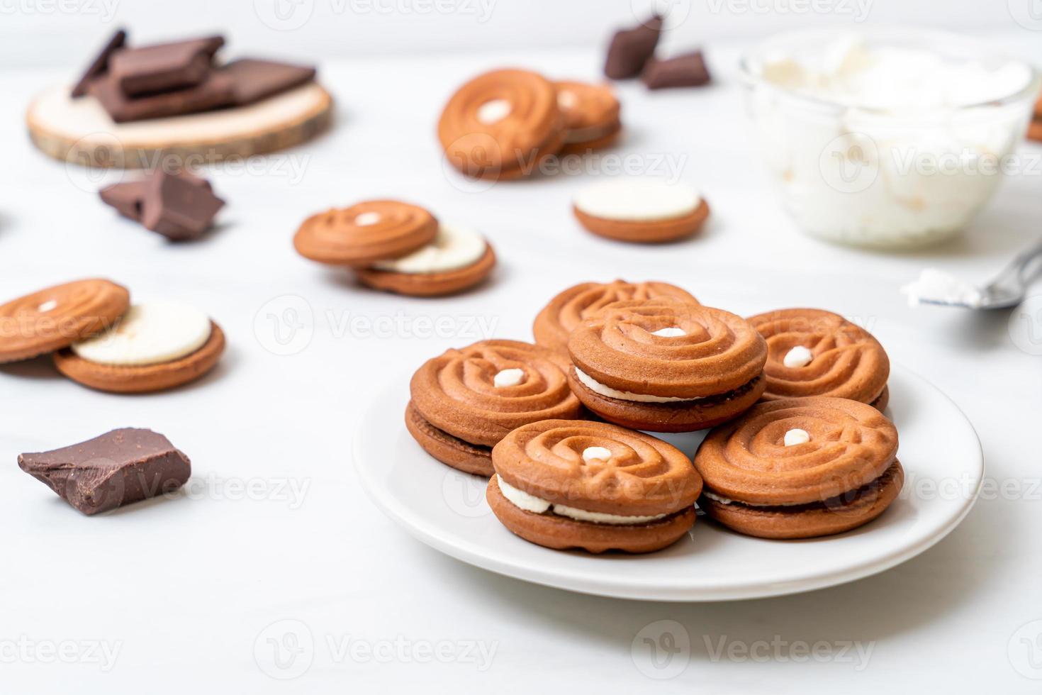 Chocolate cookies with milk cream photo