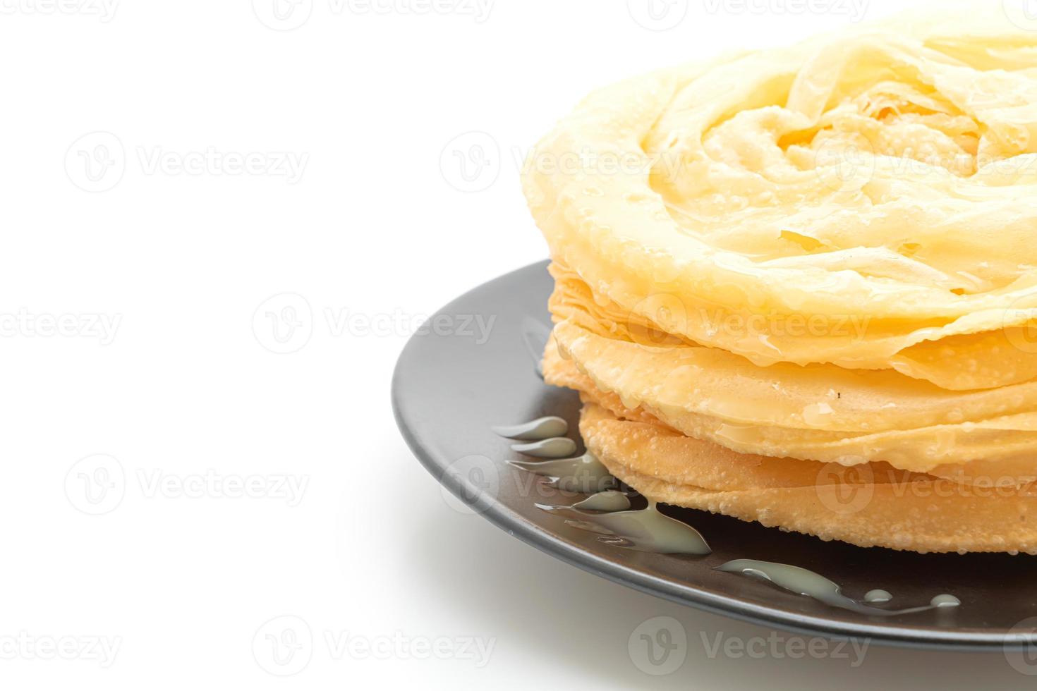 Friied crispy roti dough with sweetened condensed milk photo