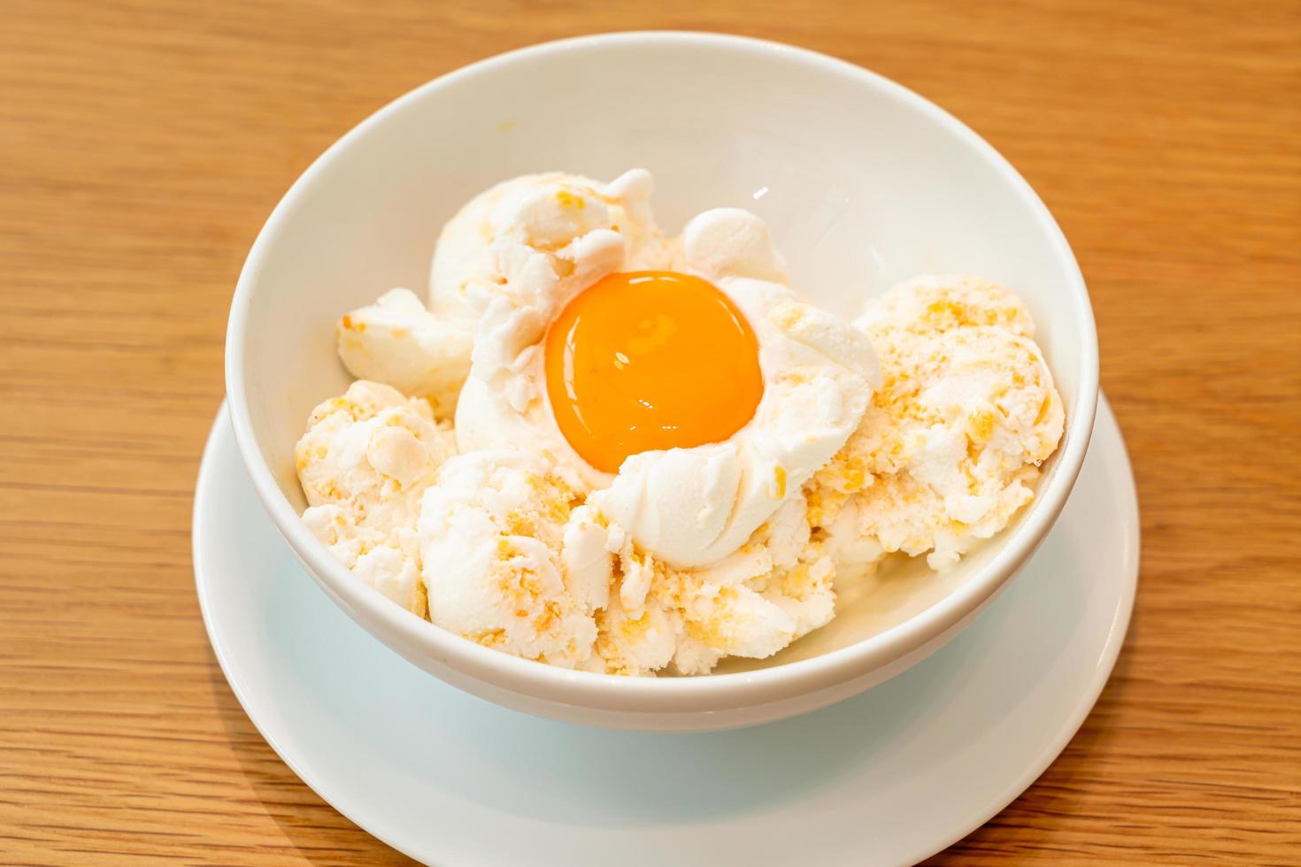 Frozen eggs ice-cream with an egg yolk photo