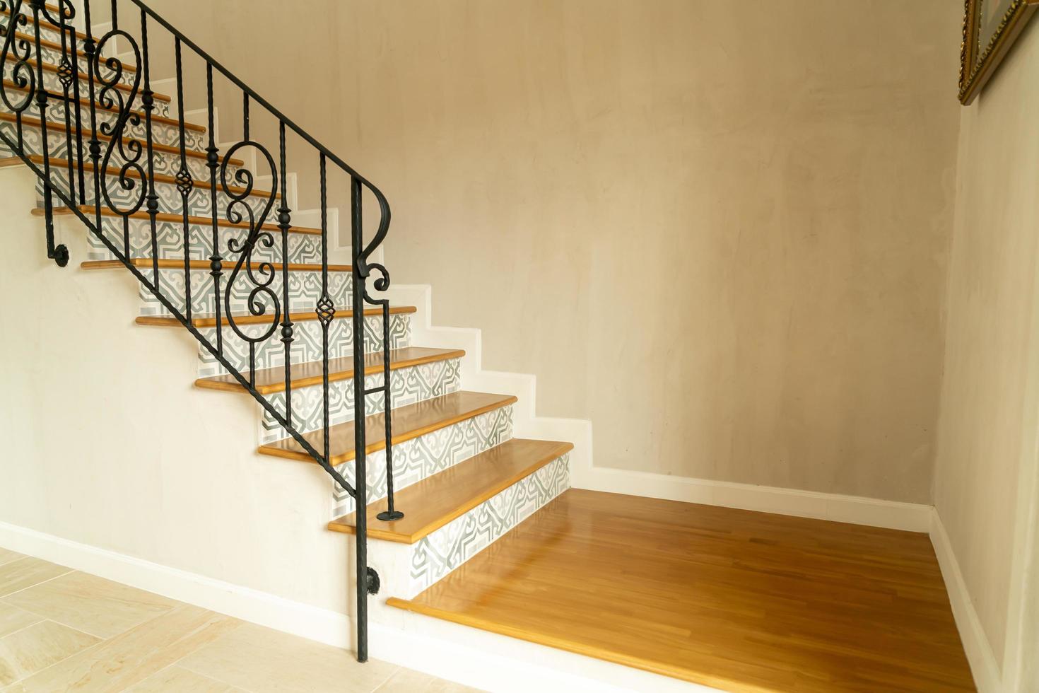 Beautiful stair steps with black handrail photo