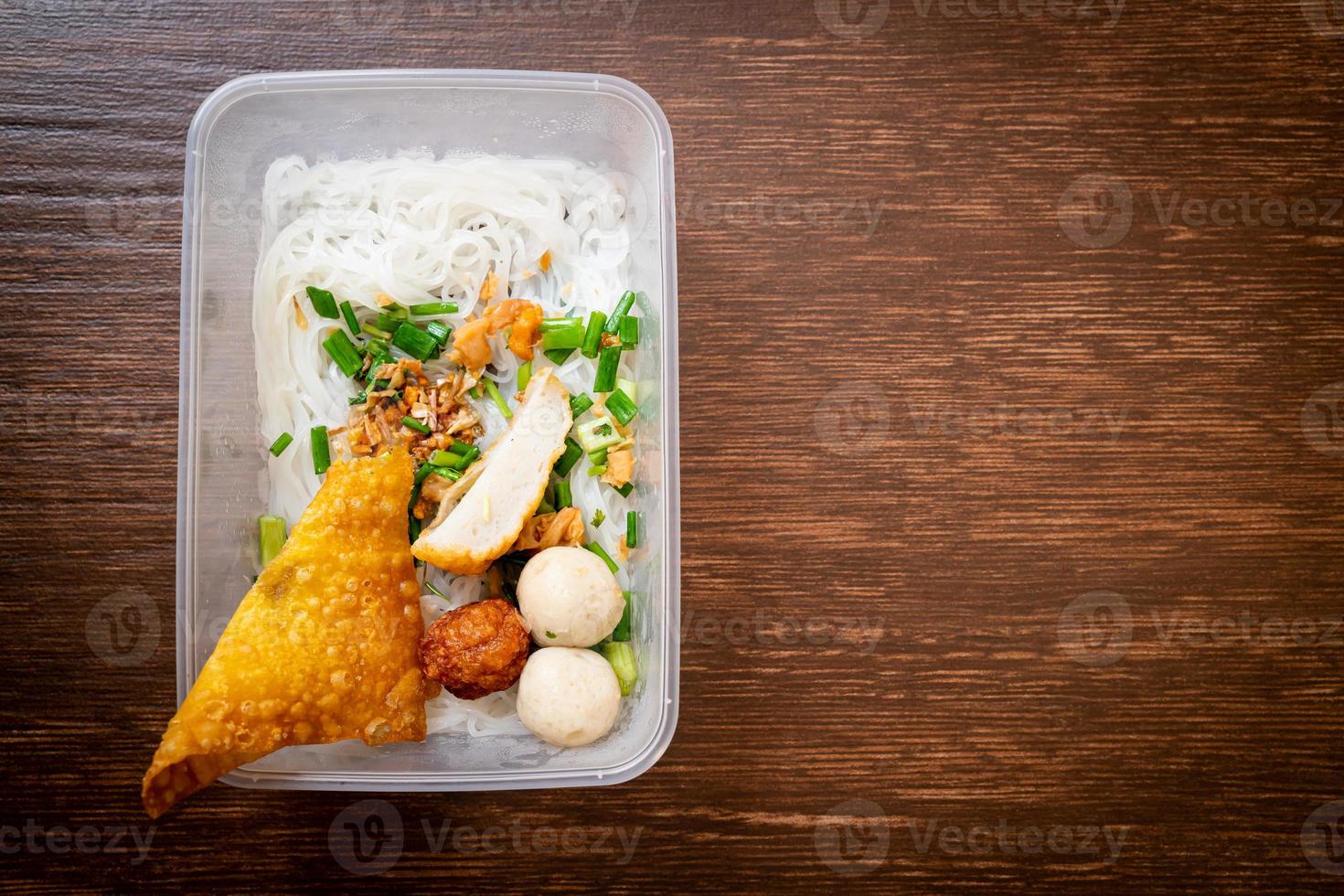 Noodles with fish ball and minced pork in delivery box - Asian food style photo