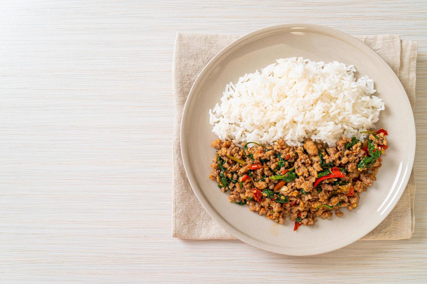 Stir fried Thai basil with minced pork on topped rice photo