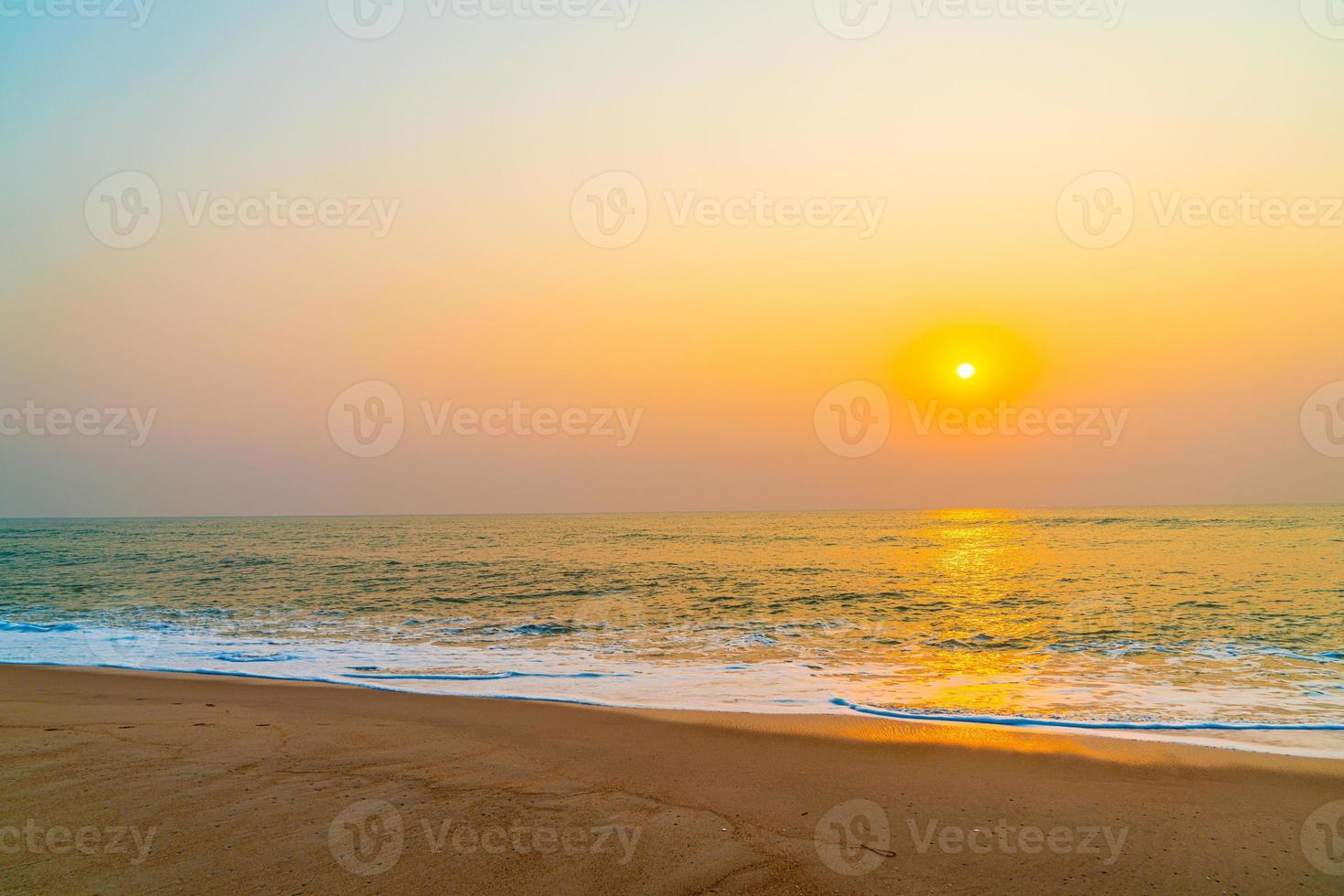 Empty sea beach with sunset or sunrise photo