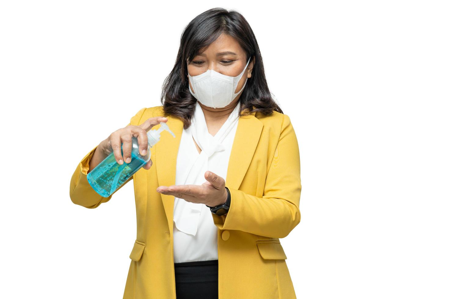 Business woman press blue alcohol sanitizer gel isolated on white background with clipping path to new normal after COVID-19 coronavirus pandemic. photo