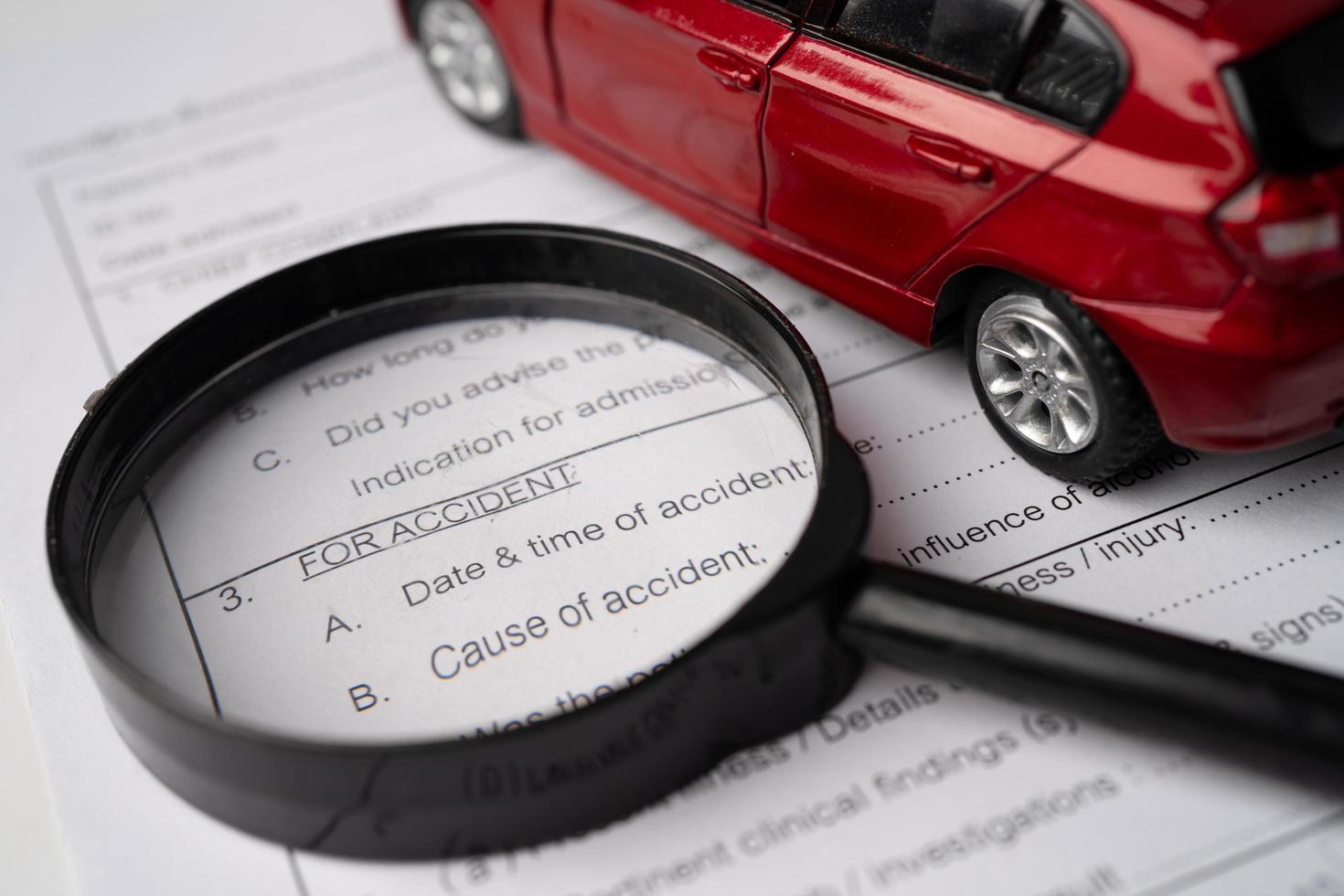 Health insurance accident claim form with car. photo