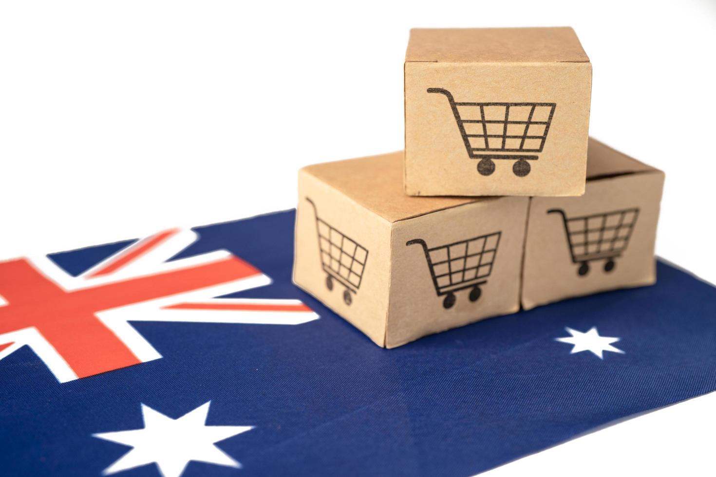 caja con el logotipo del carrito de compras y la bandera de australia, importación, exportación, compras en línea o comercio electrónico, servicio de entrega de finanzas, tienda, envío de productos, comercio, concepto de proveedor. foto